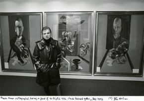 Bacon in front of Triptych, 1976, Galerie Claude Bernard, 1977. Photo and © John Minihan. MB Art Collection.