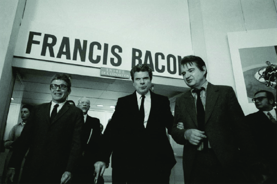 Francis Bacon with Bernard Anthonioz and Jacques Duhamel at the Grand Palais, Paris, 26 October 1971,Photo: André Morain, MB Art Collection © André Morain
